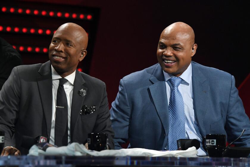 Basketball analysts Charles Barkley, right, and Kenny Smith laugh during a telecast of "NBA on TNT" on Jan. 5 in Las Vegas.