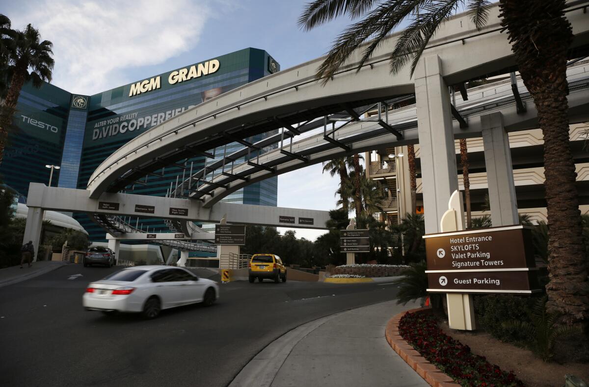 Cars drive into the parking area at the MGM Grand in Las Vegas in January. Casino giant MGM Resorts International will begin charging visitors for parking at some of its properties in Las Vegas.