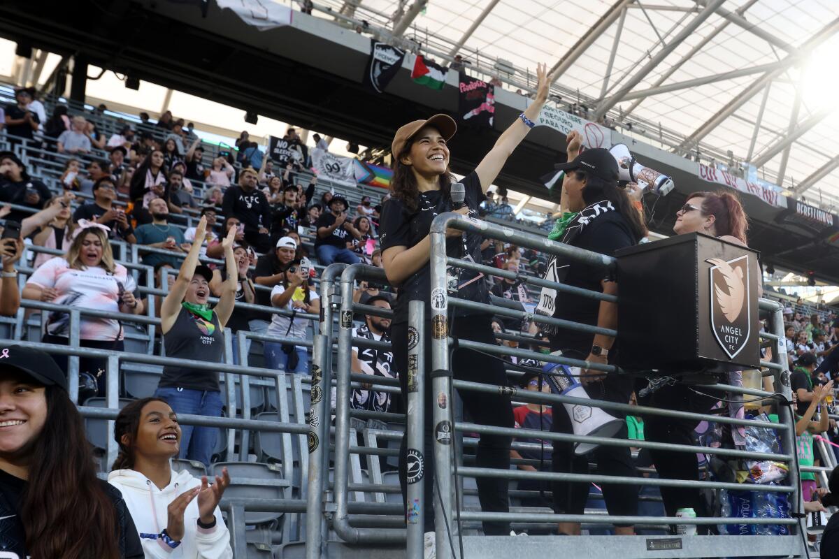 Angel City FC investor America Ferrera waves to fans before a match against the Portland Thorns at BMO Stadium in July.