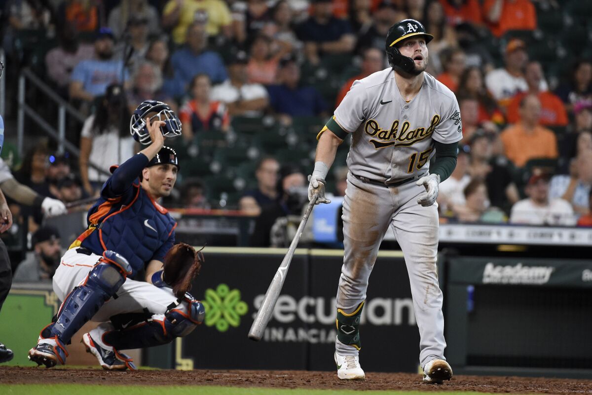 Oakland Athletics' Seth Brown watches his two-run home run during the ninth inning of a baseball game against the Houston Astros, Sunday, Oct. 3, 2021, in Houston. (AP Photo/Eric Christian Smith)