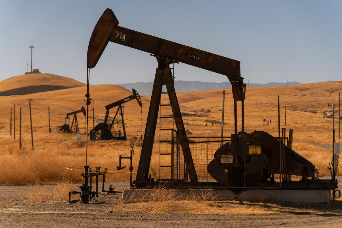 Oil pumpjacks dot the landscape near Coalinga, Calif. 