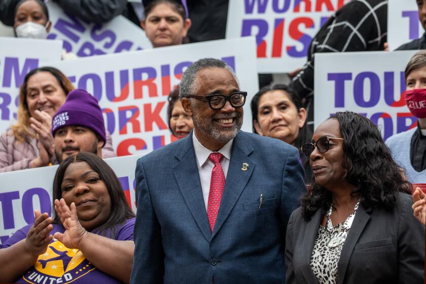 LOS ANGELES, CA - APRIL 12: Jovan Houston, a LAX worker and union members, left, Los Angeles City Councilmember Curren Price, and Yvonne Wheeler, President, LA County Federation of Labor at a press conference where Price announced his motion to raise the wages for tourism workers to $25 an hour and fix loopholes in current policies to keep workers healthy and housed. Councilman Price and unions SEIU United Service Workers West and UNITE HERE Local 11at press conference held on the steps of City Hall on Wednesday, April 12, 2023 in Los Angeles, CA. (Irfan Khan / Los Angeles Times)