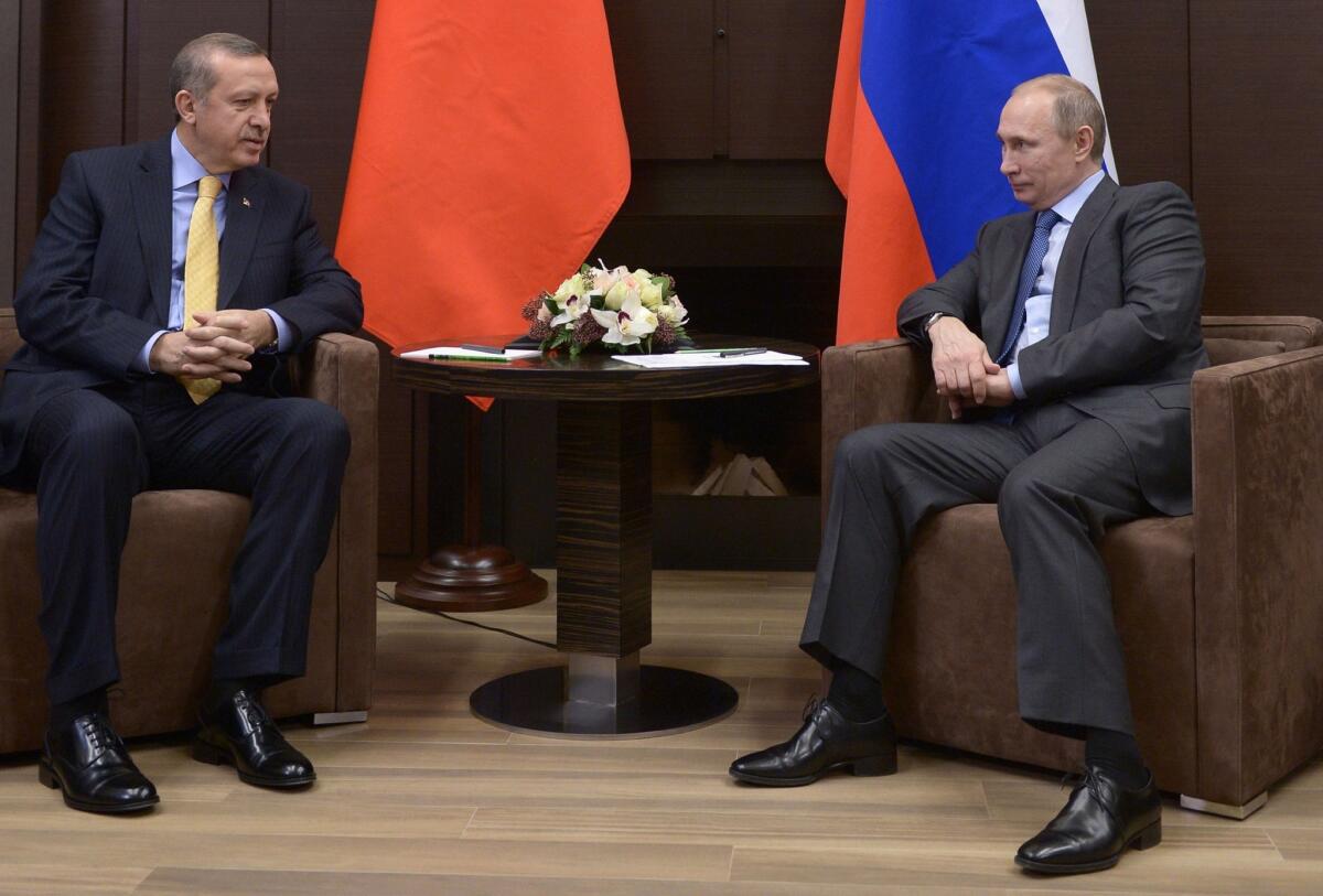 Russia's President Vladimir Putin, right, and Turkish Prime Minister Recep Tayyip Erdogan meet Friday in the Russian Black Sea resort of Sochi.