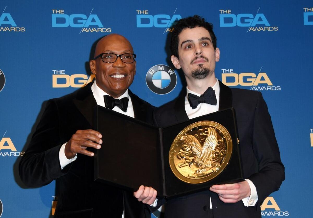 DGA President Paris Barclay, left, with director Damien Chazelle, winner of the feature film prize at the 69th Directors Guild of America Awards on Saturday night.