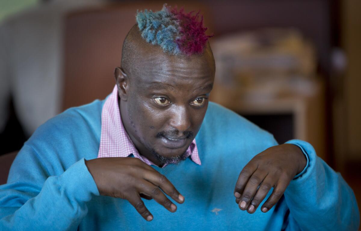 Prize-winning Kenyan author Binyavanga Wainaina talks during a television interview in Nairobi, Kenya. Wainaina, one of Africa's leading literary figures, spoke to The Associated Press to explain his decision to publicly declare his homosexuality in an online essay in January, in light of a wave of new legislation further criminalizing homosexuality in Nigeria and Uganda.