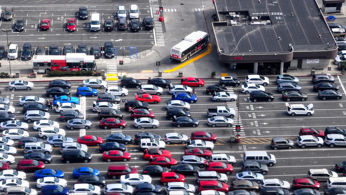 A bird-s eye view of the Avis rental car area at Los Angeles International Airport.