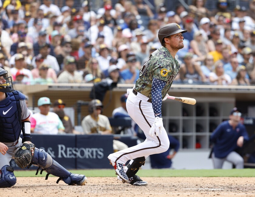 Padres designated hitter Luke Voit hits an RBI single in the fifth inning Sunday against the Twins at Petco Park.