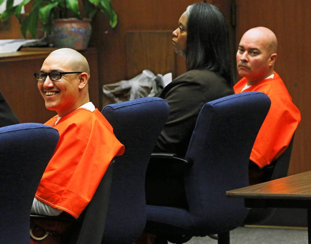 Rudy Anthony Ruiz, left, smiles during victim statements as Sandra Carrera addresses the court about the loss of her husband, Juan Carlos Carrera, during the sentencing hearing. Also shown are defendant John Michael Perez, right, and his lawyer, Cynthia Legardye.