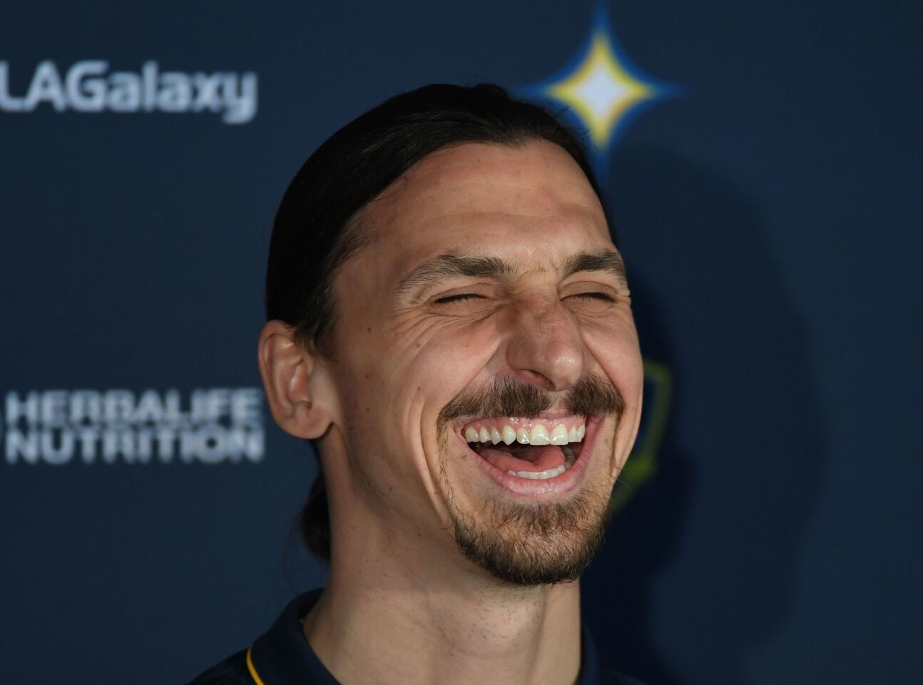 LA Galaxy footballer Zlatan Ibrahimovic laughs during his first press conference for the club in Los Angeles, California, on March 30, 2018. The 36-year-old Swedish striker's move to MLS from Manchester United was confirmed last week, with Ibrahimovic swiftly vowing to reignite the Galaxy's fortunes after they finished bottom of the league last season. / AFP PHOTO / Mark RalstonMARK RALSTON/AFP/Getty Images ** OUTS - ELSENT, FPG, CM - OUTS * NM, PH, VA if sourced by CT, LA or MoD **