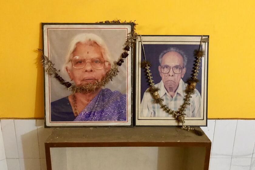 Photos of Rajam and P.V. Gopalan are displayed in their son G. BalachandranÕs house in New Delhi. Photo by Shashank Bengali