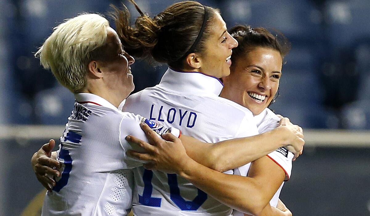 U.S. midfielder Carli Lloyd celebrates her goal against Mexico with teammates Megan Rapinoe (15) and Ali Krieger in the first half Friday night.