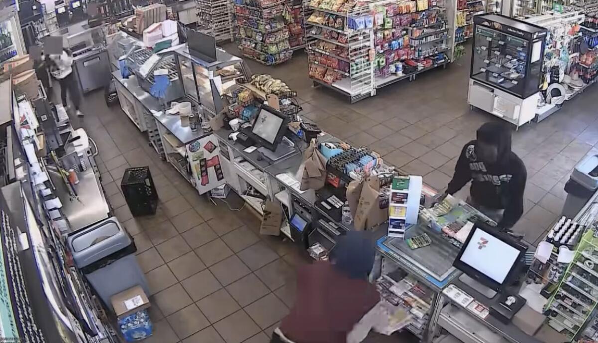 Video screenshot of suspects taking lottery Scratchers.