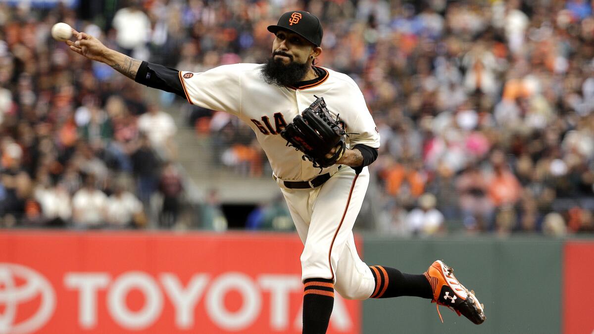 Giants reliever Sergio Romo works against the Dodgers during a game in San Francisco on April 9.