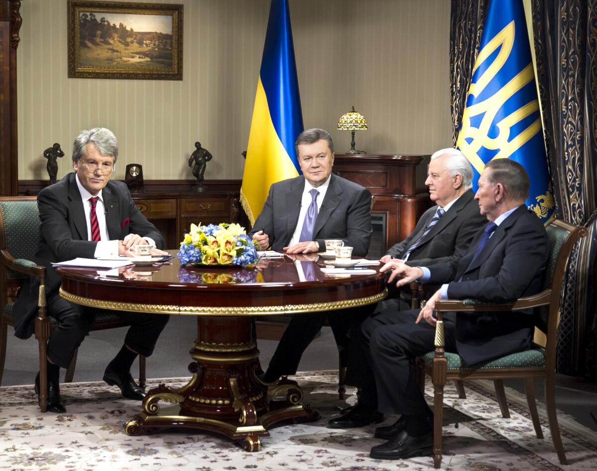 Ukrainian President Viktor Yanukovich, second left, meets in Kiev with his predecessors Viktor Yushchenko, left, Leonid Kuchma, right, and Leonid Kravchuk, second right, to discuss the situation in the country.