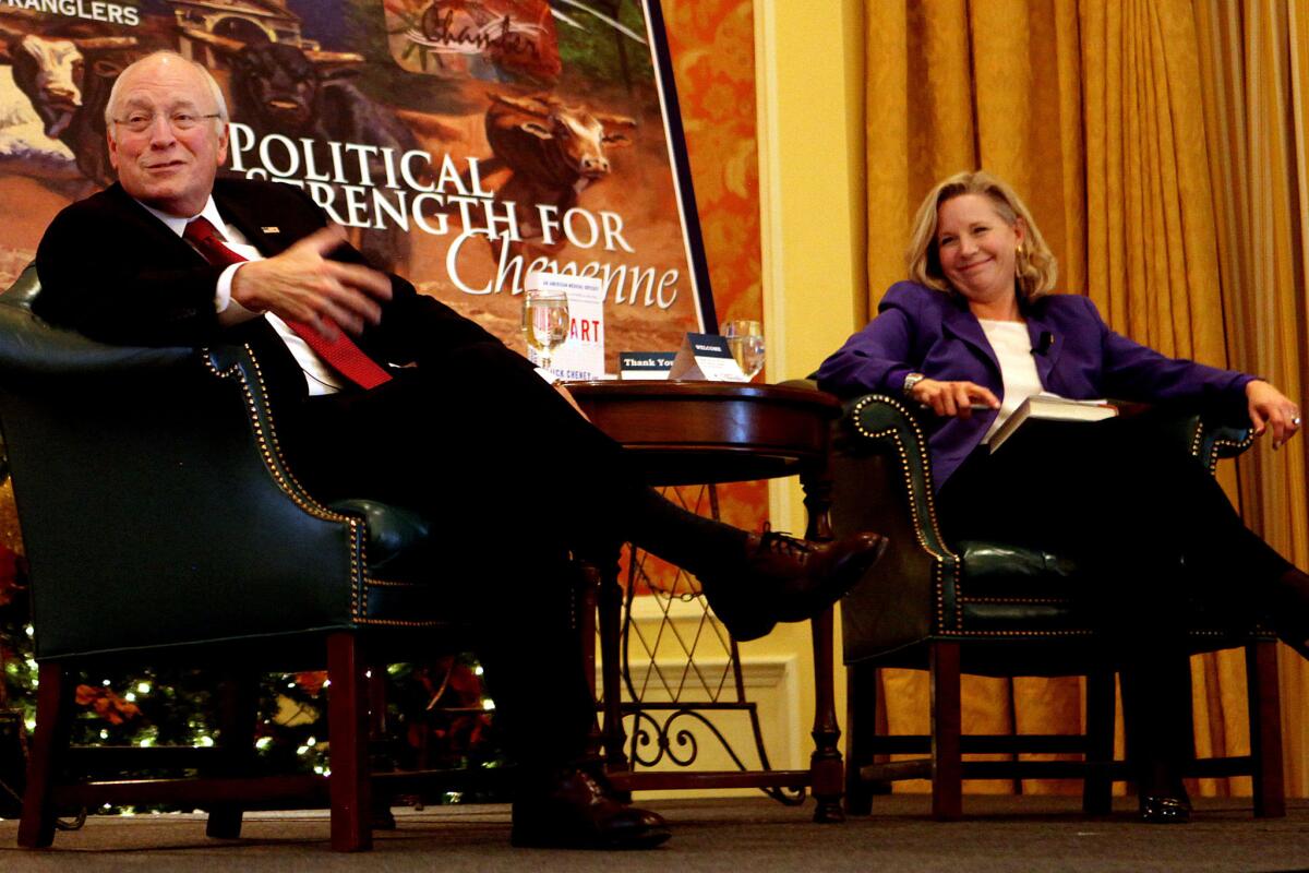 Former Vice President Dick Cheney talks about his new book, "Heart: An American Medical Odyssey," with his daughter, Liz, at Little America Hotel and Resort in Cheyenne, Wyo.