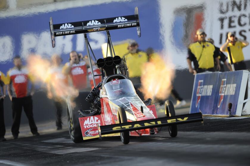 Top-fuel drag racer Doug Kalitta earns the provisional No. 1 qualifying position during NHRA competition last month at Wild Horse Pass Motorsports Park in Chandler, Ariz.