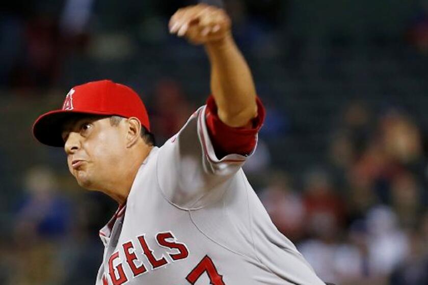 Angels reliever Cesar Ramos throws a pitch against the Rangers earlier this month.