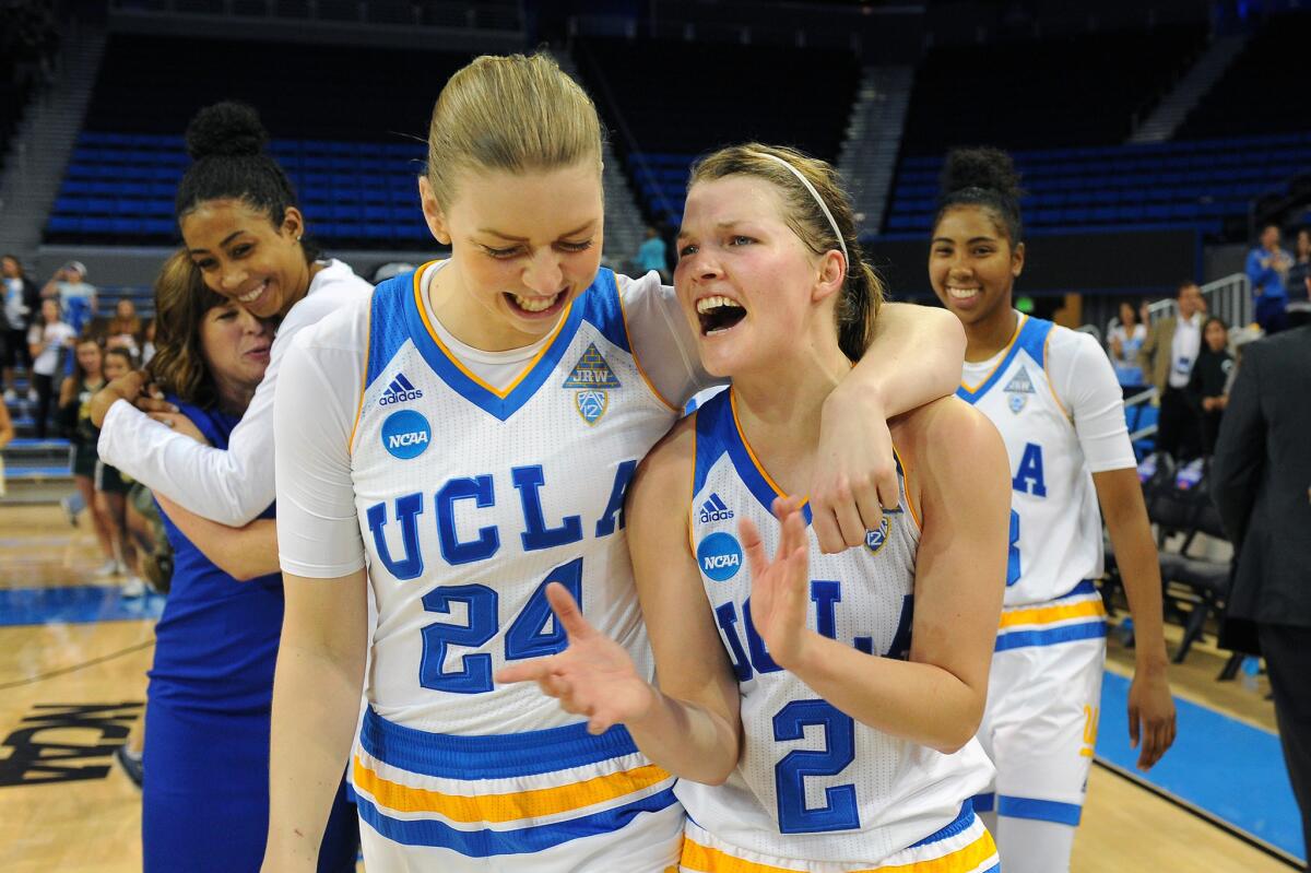 UCLA's Paulina Hersler (24) and Kari Korver (2) celebrate after beating South Florida 72-67 to advance to the Sweet 16.