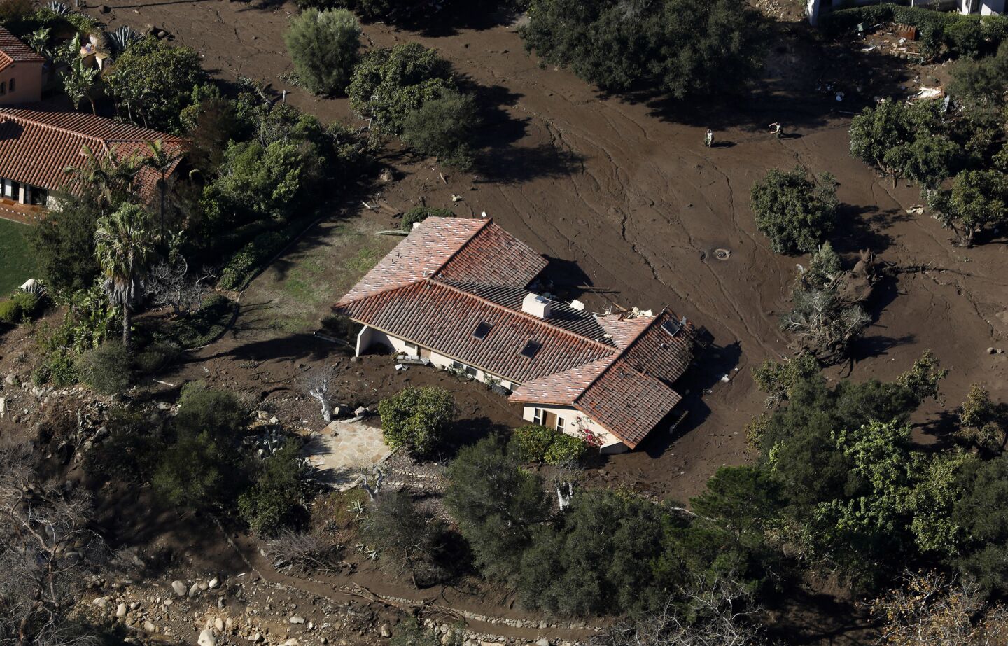 A home off of Romero Canyon Road in Montecito is inundated with mud.