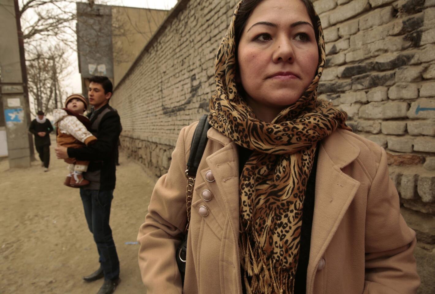 Ghazalan Koofi, 26, waits for a ride to work as her brother-in-law Shafiq Azizi holds her baby, Ahmad, 11 months. Despite growing up under Taliban rule, Koofi was able to graduate from high school, and is now studying literature in college. But with U.S. combat troops leaving Afghanistan next year, Koofi and other Afghan women worry that their freedoms will begin to erode. "We are entering a very dangerous period for women," Koofi says.