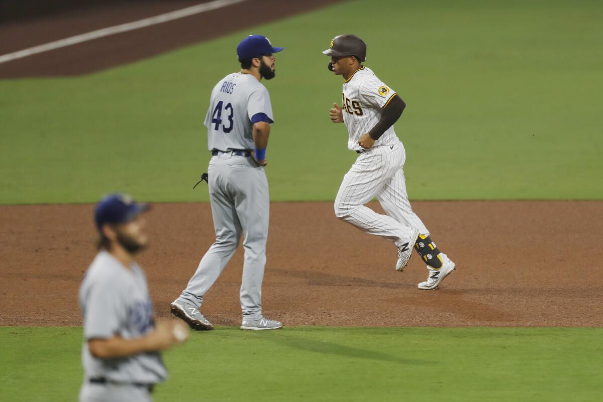 Trent Grisham of the Padres rounds the bases after hitting a home run in the sixth inning.