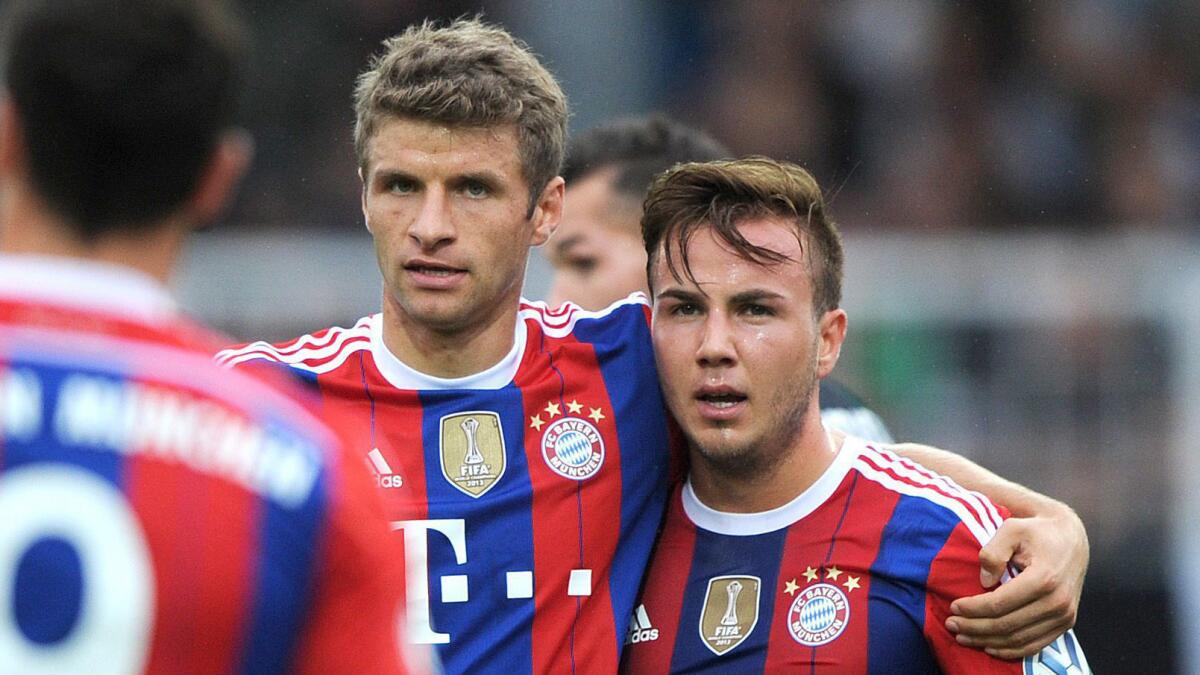 Thomas Mueller, left, and Mario Goetze celebrate a Bayern Munich goal against Preussen Muenster on Aug. 17. Germany's World Cup victory showcased the high level of talent present in the Bundesliga.