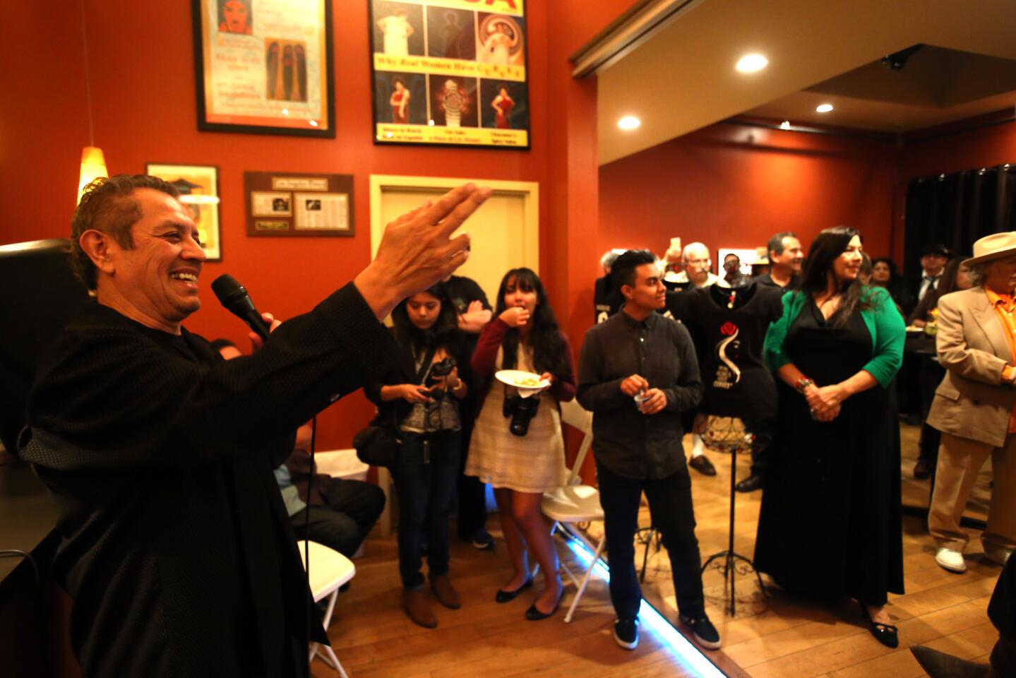 David Reyes gives the opening statement at the opening of the "Roots of the Eastside Sound 1955-1965" exhibit, which features rare photos and memorabilia from the East L.A. rock 'n' roll scene from Reyes' personal collection at the Jean Deleage Art Gallery in the lobby of the Casa 0101 Theater in Boyle Heights.