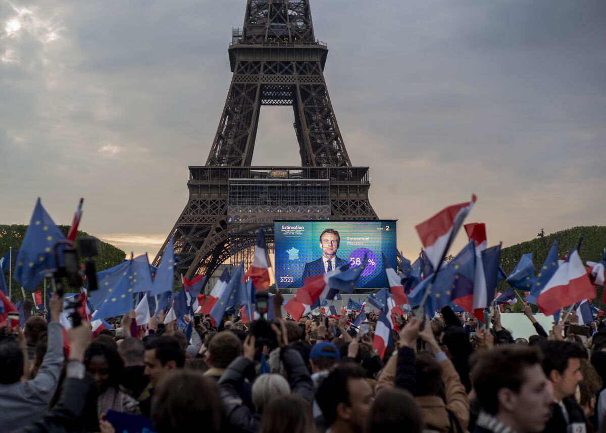 French President Emmanuel Macron celebrates with supporters