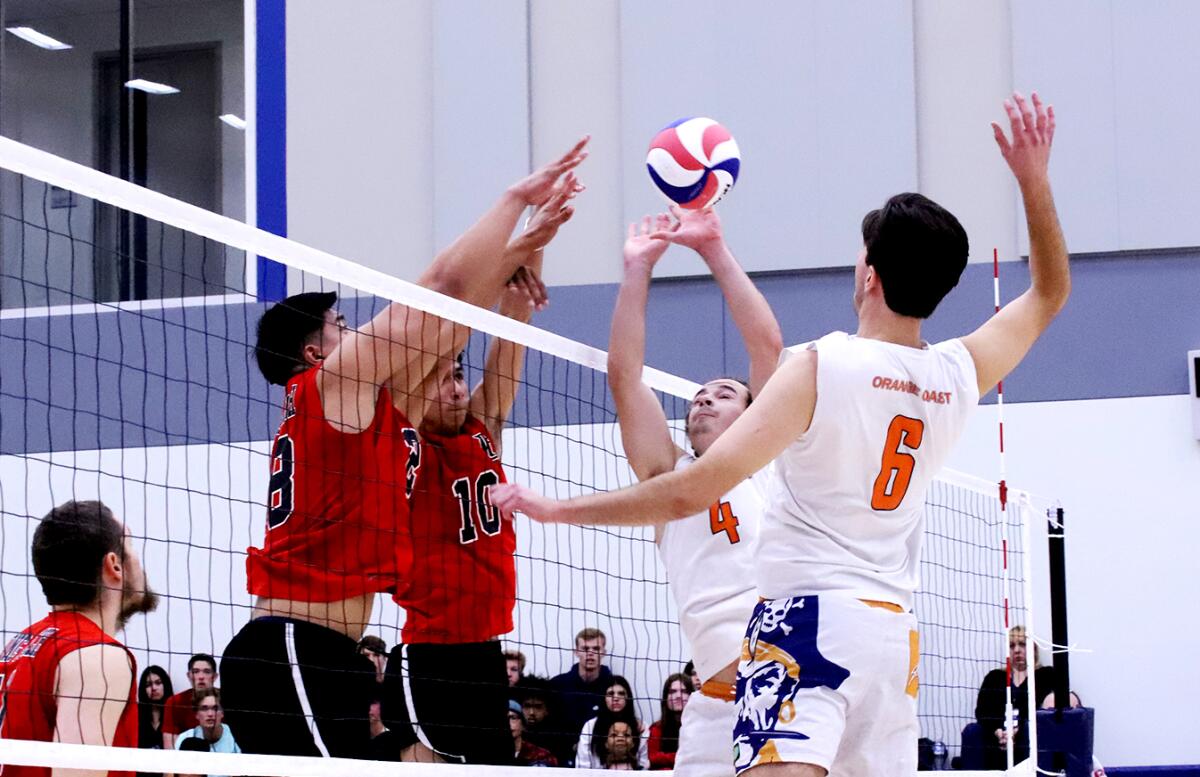 Orange Coast's Grayson Kling (4) sets up Zach Weston (6) for the kill against Long Beach in the CCCAA state final.