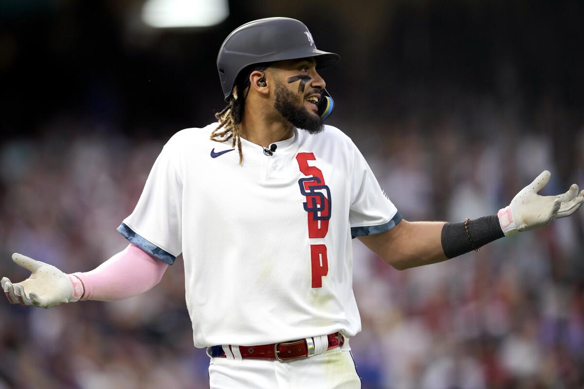 National League's Fernando Tatis Jr., of the San Diego Padres, reacts after flying out during the third inning of the MLB All-Star baseball game, Tuesday, July 13, 2021, in Denver. (AP Photo/David Zalubowski)