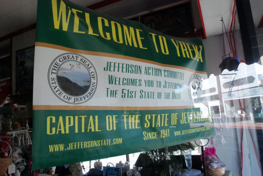 A banner welcoming visitors to the State of Jefferson hangs in the window of a downtown business in Yreka, Calif., home to one of several secession movements across the country.