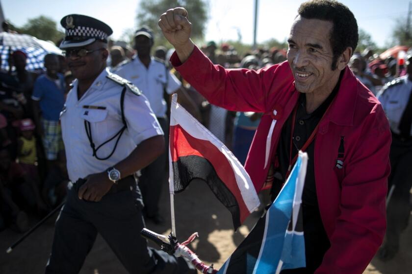Incumbent Botswana President Seretse Ian Khama rides a bicycle while campaigning in the Naledi district of Gaborone, on October 17, 2014. General elections in Botswana are to be held on October 24, 2014. The last half century has been very good to southern Africa's political incumbents -- but persistent poverty and unemployment are now fuelling the rise of populists vowing to upend the economic status quo, with Botswana's pro-Western President Ian Khama weary of the rise of the opposition Botswana National Party asking for "regime change". AFP PHOTO//MARCO LONGARI (Photo credit should read MARCO LONGARI/AFP/Getty Images)