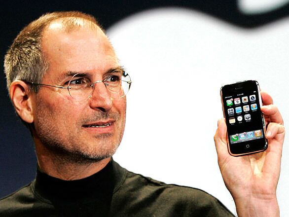 Jobs demonstrates the new iPhone, a gadget with the capabilities of both an iPod and a cellphone, at the 2007 MacWorld conference.