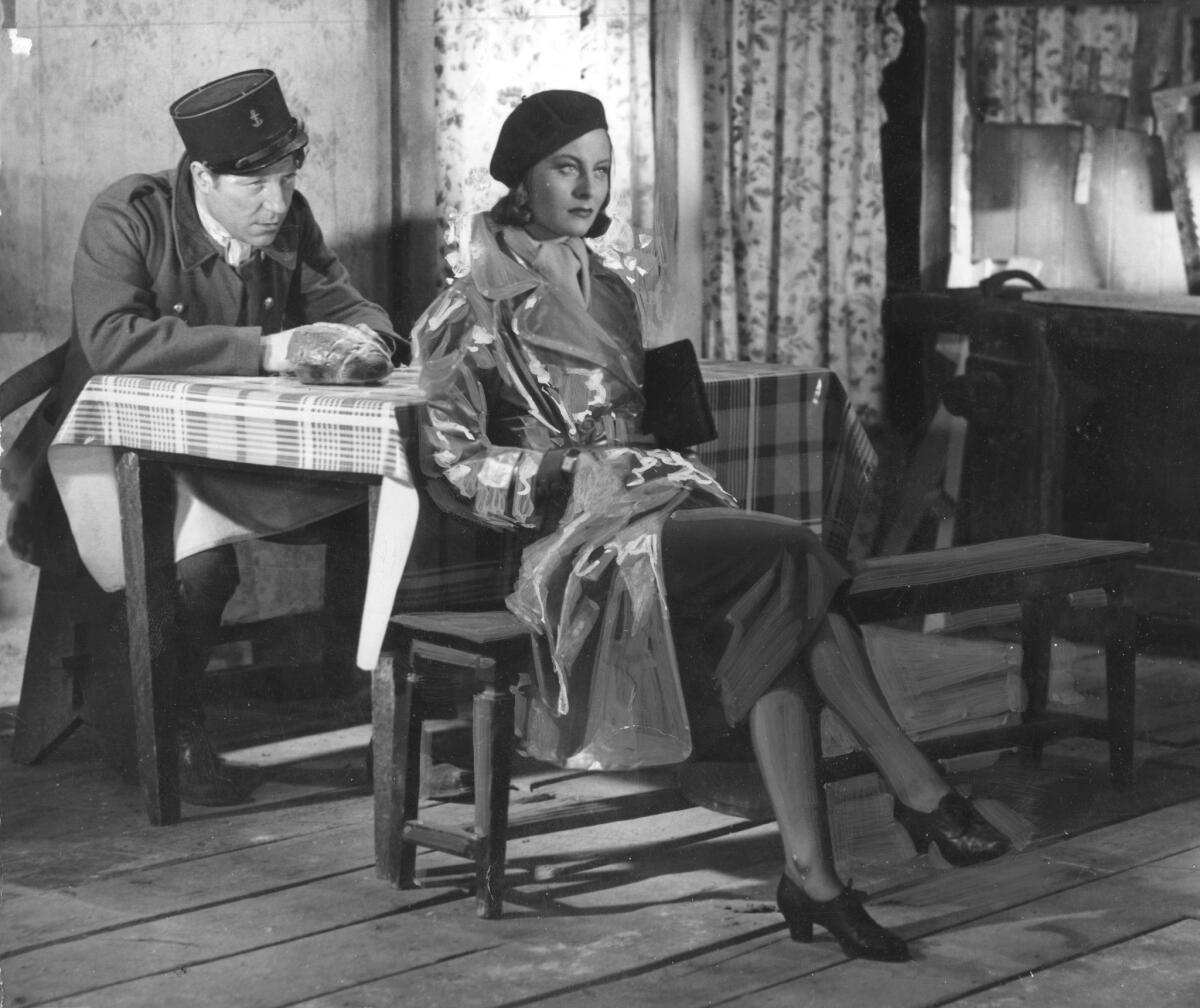 French actress Michele Morgan with Jean Gabin in a scene from "Quai des brumes" ("Port of Shadows"). She was the first winner of the Cannes best actress award.