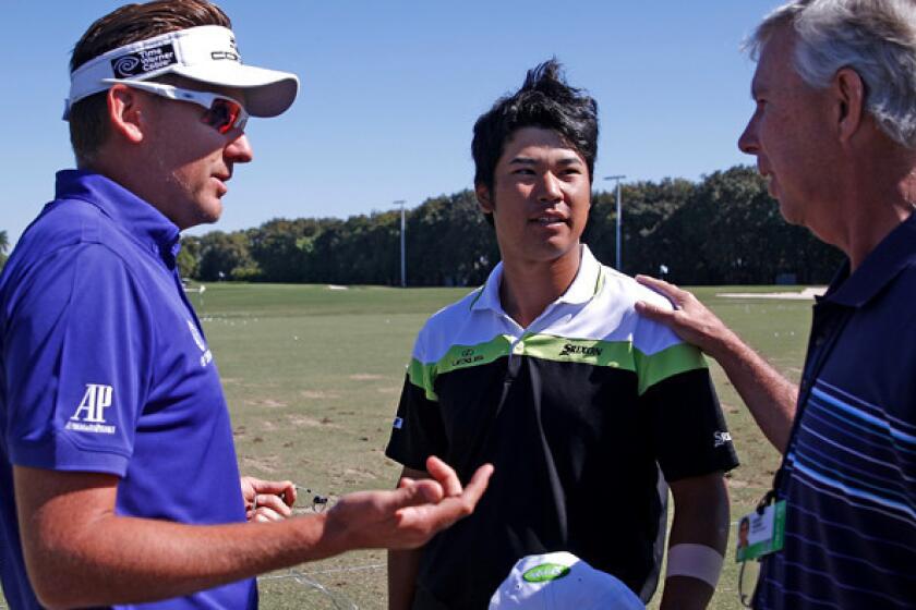 Ian Poulter, left, talks to Hideki Matsuyama, center and his interpreter Robert Turner at the driving range on Saturday morning before the third round of the Cadillac Championship at Doral, Fla.