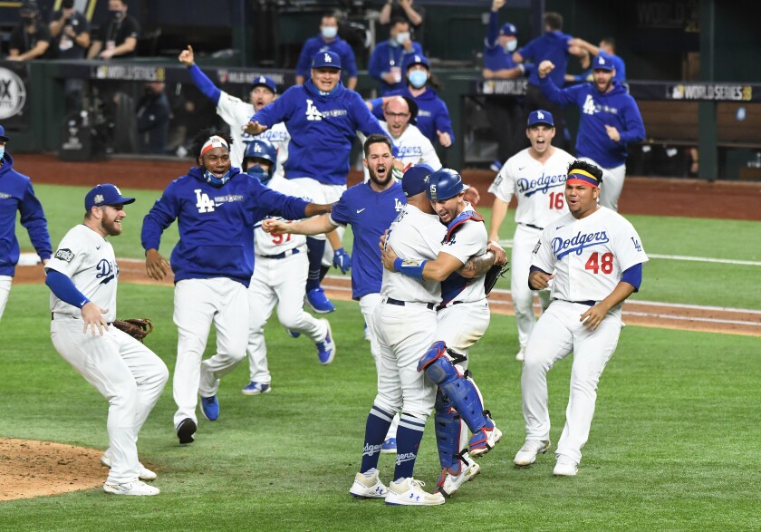 Dodgers baserunner Austin Barnes scores in front of Tampa Bay Rays pitcher Nick Anderson.