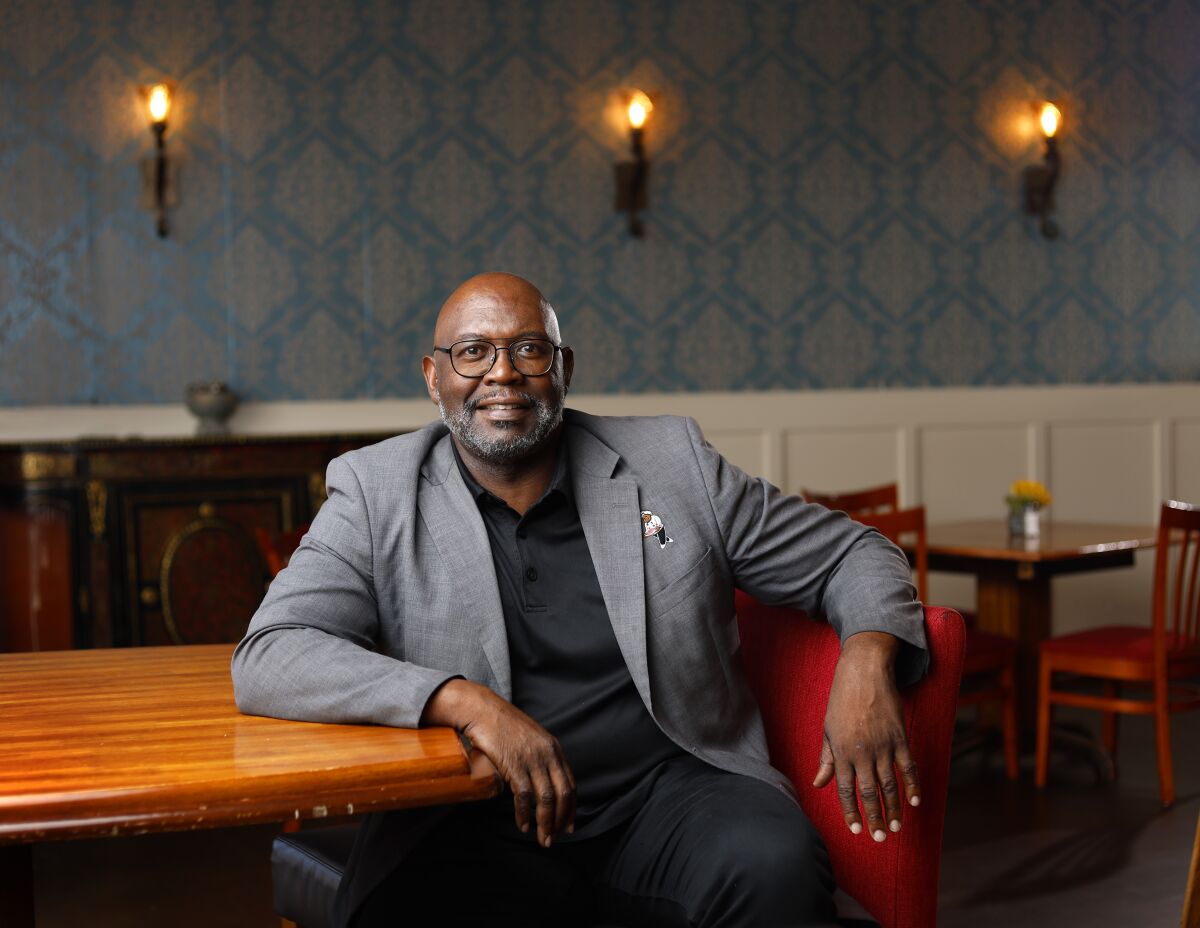 Felix Berry sits at a table of his Felix's BBQ With Soul restaurant in Oceanside.