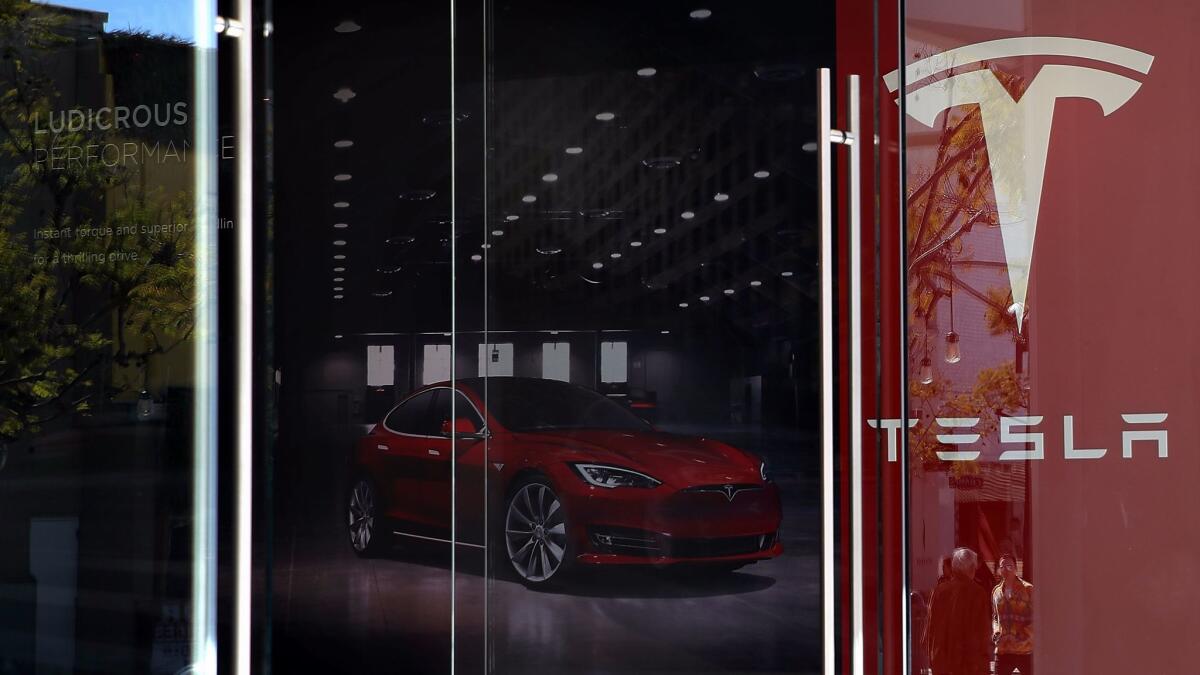 A Tesla showroom in Santa Monica on Feb. 17. Chinese tech firm Tencent has bought a 5% stake in Tesla.