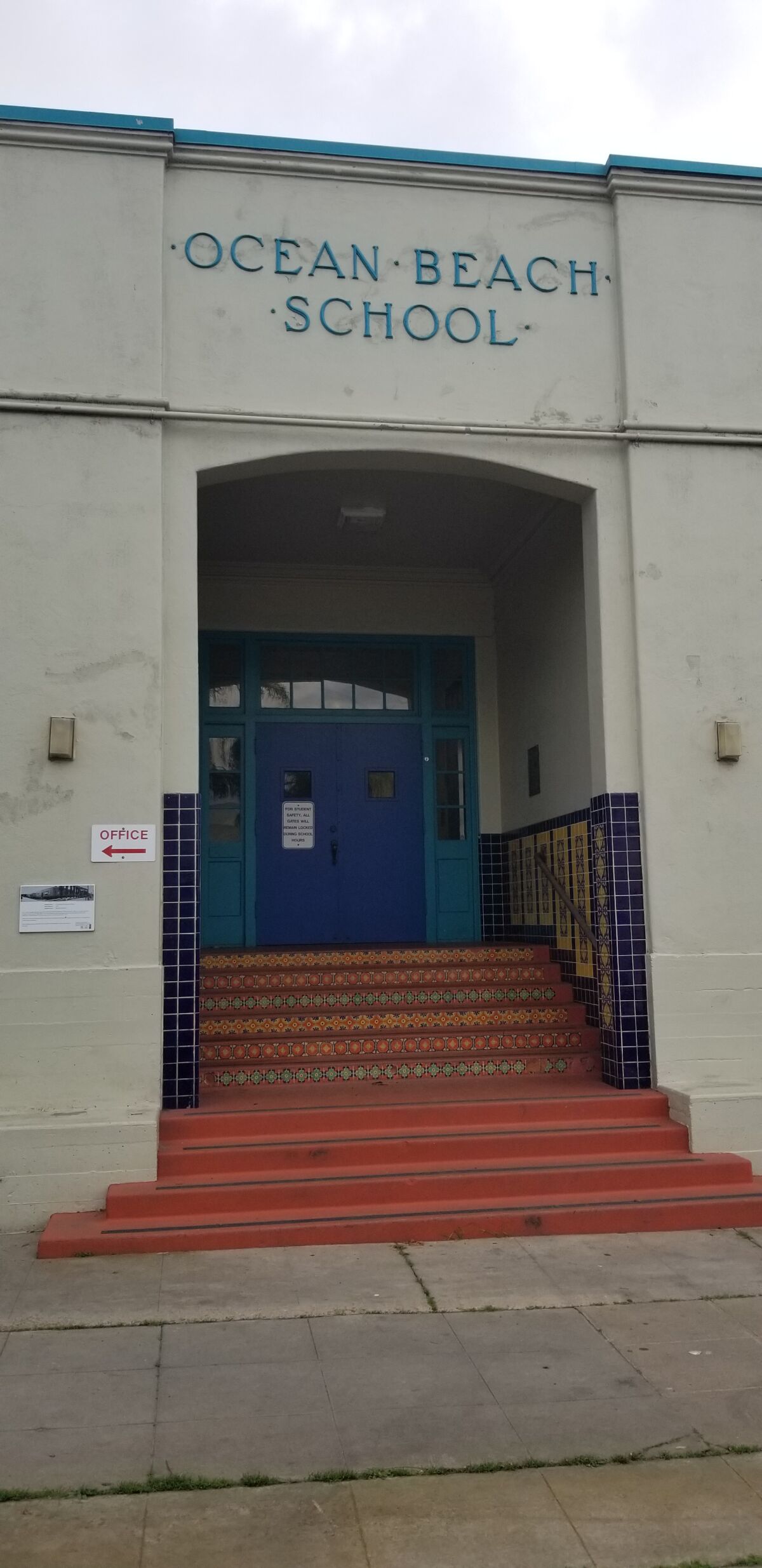 The historical plaque at OB Elementary School can be seen to the left of the door.