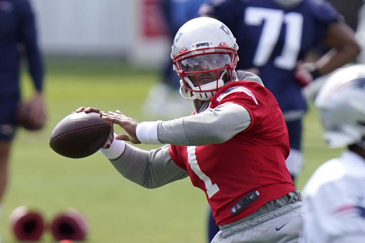New England Patriots quarterback Cam Newton (1) winds up for a pass.