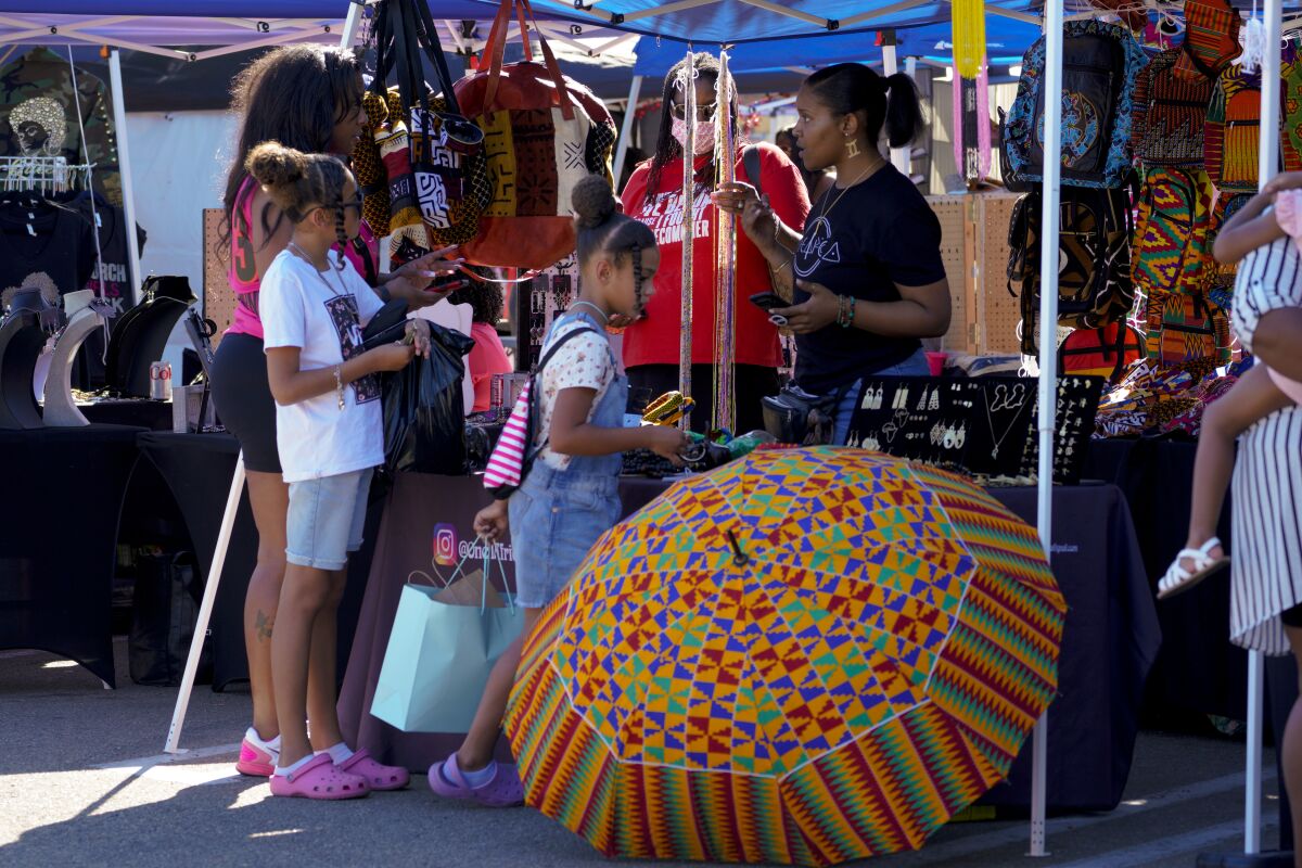 Shoppers enjoy the Soul Swapmeet at Westfield Mission Valley on a recent Saturday.