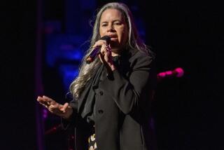 FILE - Natalie Merchant performs at Cyndi Lauper's 8th Annual "Home for the Holidays" benefit concert in New York on Dec. 8, 2018. Merchant's latest album, "Keep Your Courage," releases on Friday. (Photo by Charles Sykes/Invision/AP, File)