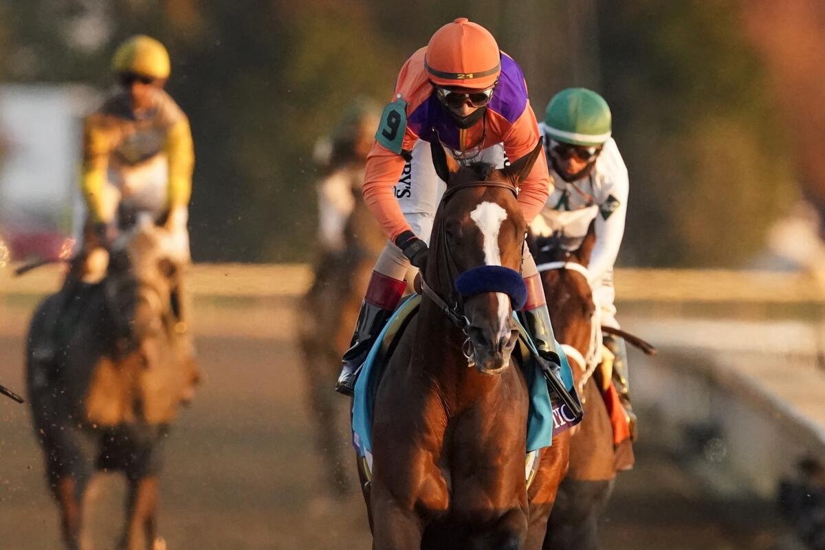 Jockey John Velazquez (9) rides Authentic to a win in the Breeders' Cup Classic on Nov. 7, 2020, in Lexington, Ky.
