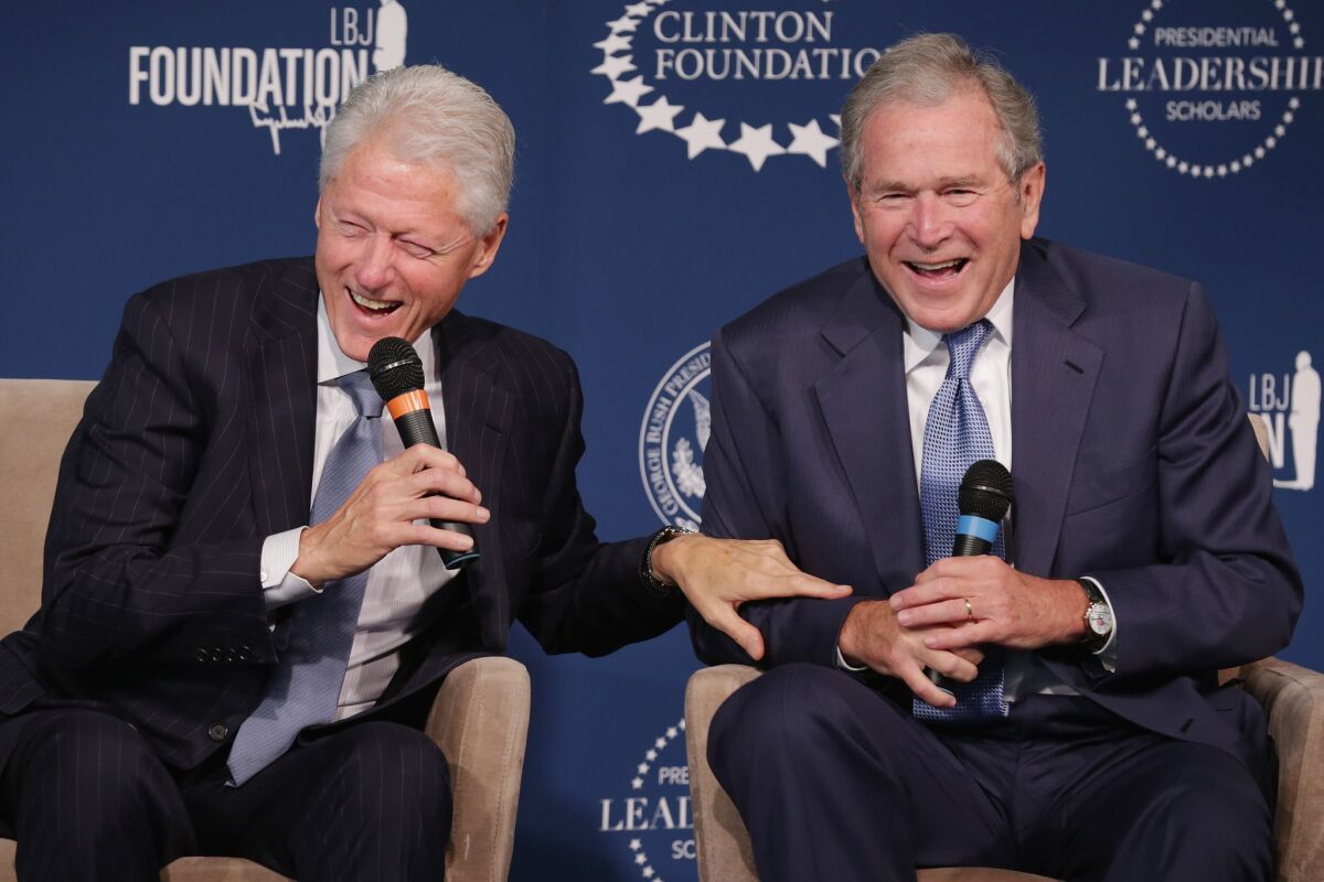 Former Presidents Bill Clinton and George W. Bush during a joint appearance in Washington. Clinton, improbably, has emerged as arguably the most popular political figure in America.