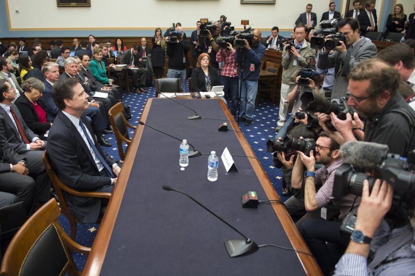 FBI Director James Comey prepares to testify at the House Judiciary Committee hearing on 'The Encryption Tightrope: Balancing Americans' Security and Privacy,' on Capitol Hill on March 1.