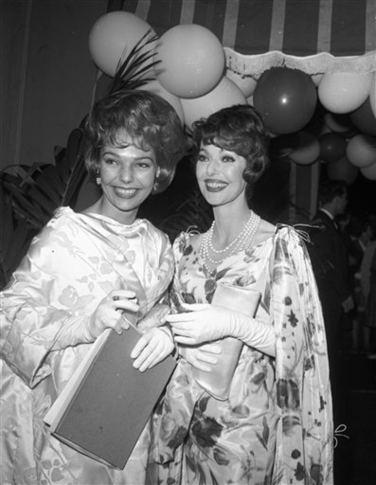 In this May 16, 1961 file photo, actress Loretta Young, right, and her daughter Judy Lewis attend a party following the Emmy awards in Hollywood.