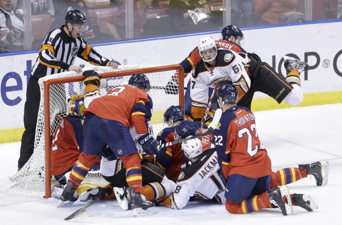 The Ducks and Panthers pileup in front of the Florida goal during the second period of a game Tuesday at BB&T Center. The Ducks lost to the Panthers, 6-2.