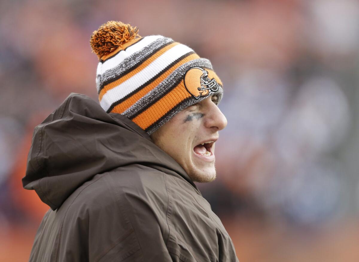Johnny Manziel watches from the sidelines as the Cleveland Browns lose to the Indianapolis Colts, 25-24, on Dec. 7.