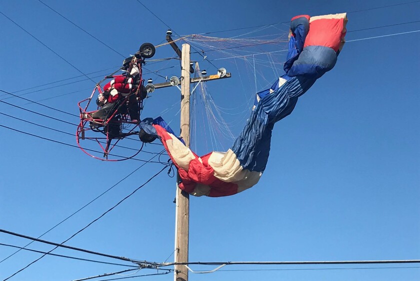 The Sacramento Metropolitan Fire District rescued a paraglider dressed as Santa on Sunday.