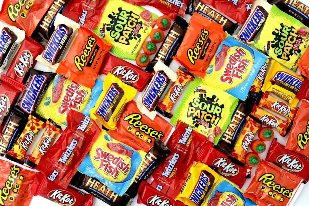Multiple brands of candy in brightly colored wrappers
